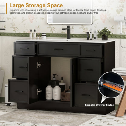 Open drawers showing storage inside a black bathroom vanity